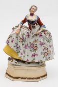 A Nymphenburg porcelain figure after a Meissen original: modelled with an elegant figure in broad