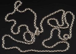 A long, silver Albert chain: of oval linking, approximately 2.55oz.