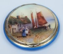 A continental silver-gilt and enamel compact: the hinged lid decorated with a painted scene of a