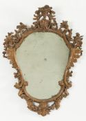 An 18th Century Italian carved giltwood and gesso cartouche-shaped mirror:, with palmette,
