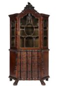 A 19th Century Dutch Colonial carved walnut display cabinet:, of canted design,
