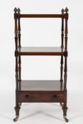 An early 19th Century rosewood three tier whatnot:, with reeded finials,