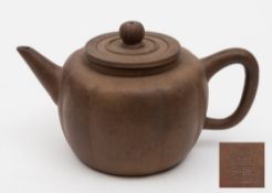 A Chinese Yixing teapot: of melon shaped form with pierced liner,