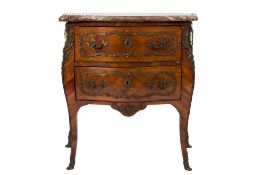 An early 19th Century French kingwood and gilt metal mounted serpentine fronted bombe commode in