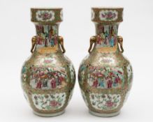 A pair of Canton porcelain vases: of oviform with raised and pan topped necks and elephant mask