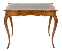 A Victorian walnut, inlaid and gilt metal mounted writing table in the French taste:,