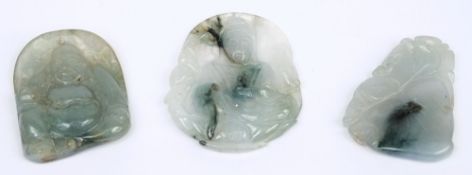 A Chinese celadon jade pendant: carved on one side with a seated Buddah,
