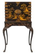 A 19th Century Chinese black lacquer and gilt decorated and brass mounted cabinet on a later stand:,