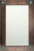 An Arts and Crafts period beaten copper mirror:,