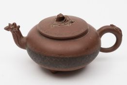 A Chinese Yixing teapot and cover: of compressed globular form with chilong spout,