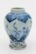A Chinese porcelain tea canister: of lobed oviform with applied scroll moulded base,
