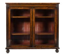 A William IV rosewood and inlaid low bookcase:, the frieze decorated with brass lines,
