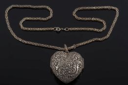 A late Victorian silver heart-shaped photograph locket: the large heart-shaped locket with all over