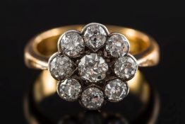 A diamond nine-stone circular cluster ring: with circular,