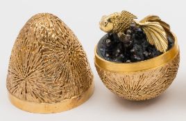 A Stuart Devlin silver-gilt egg, London, 1971: fish en tremblant, 7.5cm.