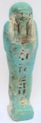 An Egyptian blue faience ushabti: with panel of hieroglyphics, bears label 