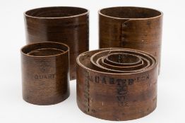 A set of five Victorian graduated bentwood measures: includes quarter peck, quart,  pint,