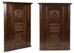 A pair of 18th Century French Breton oak hanging corner cupboards:,