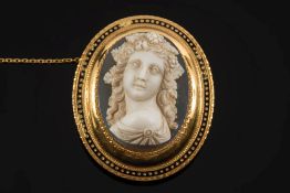 A late 19th century French gold and oval hardstone cameo portrait brooch:,