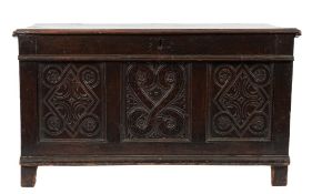 An early 18th Century oak rectangular coffer:, with a plain hinged moulded top,