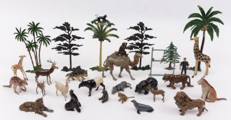 A large collection of Britains zoo animals and related fences , entrance and kiosk:,