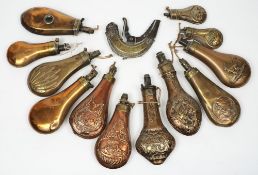 A collection of thirteen late 19th /early 20th century brass and copper shot flasks:,