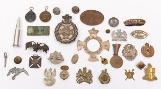 A Royal Montgomery Rifles helmet plate:,