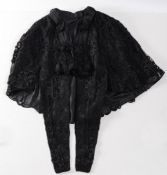 A Victorian black lace and silk embroidered mourning jacket:..