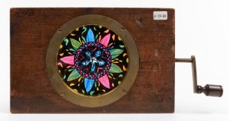 A 19th century mahogany and brass chromatrope slide:,