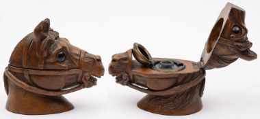 A Victorian carved wood inkwell: in the form of a horse's head: with inset glass eyes,