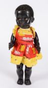 A Pedigree black plastic doll: with curly hair, weighted brown eyes,