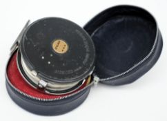 A Ryobi 455 salmon reel with line and case:.