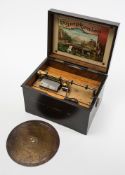 A late 19th century German table top Symphonion: contained in an ebonised and transfer print