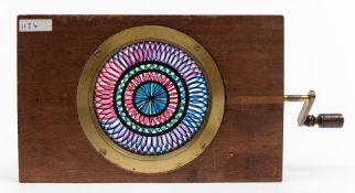 A 19th century chromatrope slide:, the central roundel of blue,