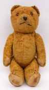 A pale plush Teddy bear with rounded wide apart ears, stitch snout and canvas pads:, 35cm high.