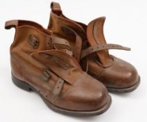 A pair of early 20th century brown leather and canvas cross country ski boots, size 12:,