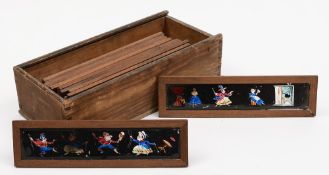 Fifteen various early caricature slides in pencil cedar frames and five unframed examples:.