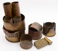 Two pairs of brass shell cases, a small trench art example, another large litter bin shell case,