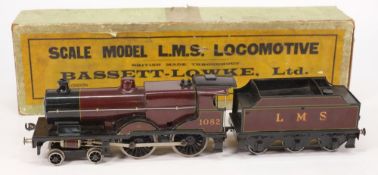 A Bassett-Lowke 3RE 4-4-0 compound locomotive No 1082: with six wheel tender in LMS maroon livery,