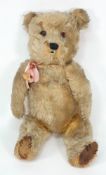 An early 20th Century teddy bear: 43cm high,