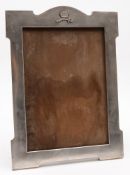 An Eastern white metal photograph frame with crown and sabre decoration:, 40 cm high.
