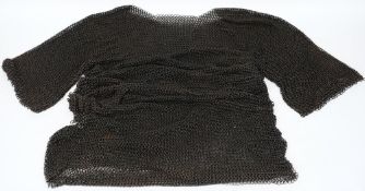 A knee length chain mail tunic:.