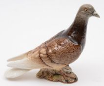 A Beswick model of a pigeon:, with brown and cream plumage and grey head and beak,