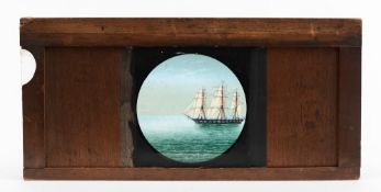 A 19th century hand painted panoramic slip slide of a frigate:, 23cm wide.