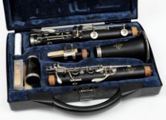 An ebony five section clarinet by  Buffet Crampon & Cie,