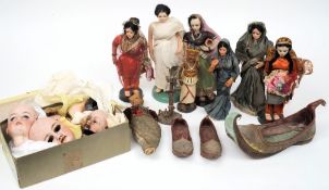 A collection of late 19th century bisque doll's heads: (damaged) together with a collection of