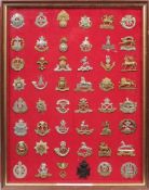 A collection of mostly modern Army badges: mounted and framed.