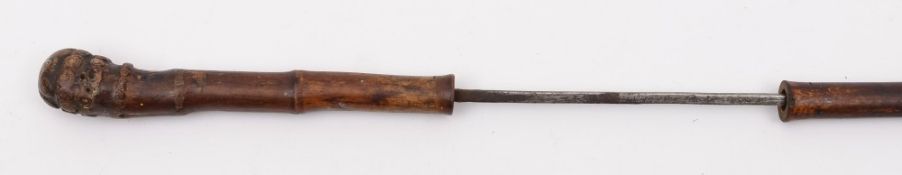 A Victorian bamboo sword stick: with plain square tapering 54cm blade, overall length 85.5cm.
