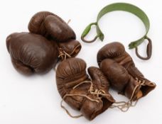 Two pairs of brown leather boxing gloves:, with maker's labels for Frank Bryan Ltd, London,