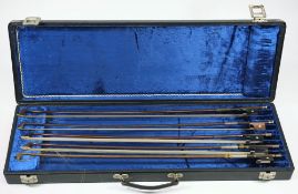 A group of five assorted violin bows:, all unsigned, various weights,